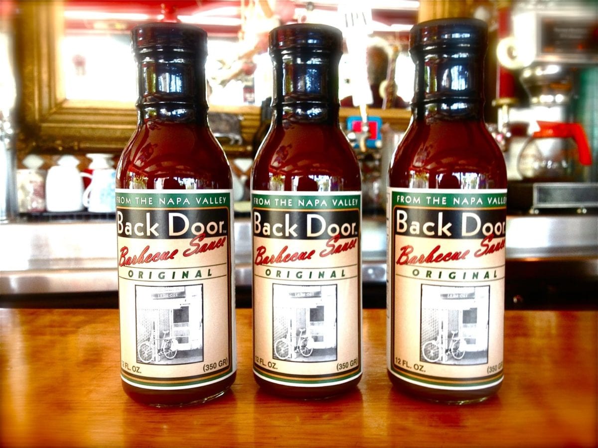Bottles of Red Rock Cafe and Back Door BBQ's barbecue sauce