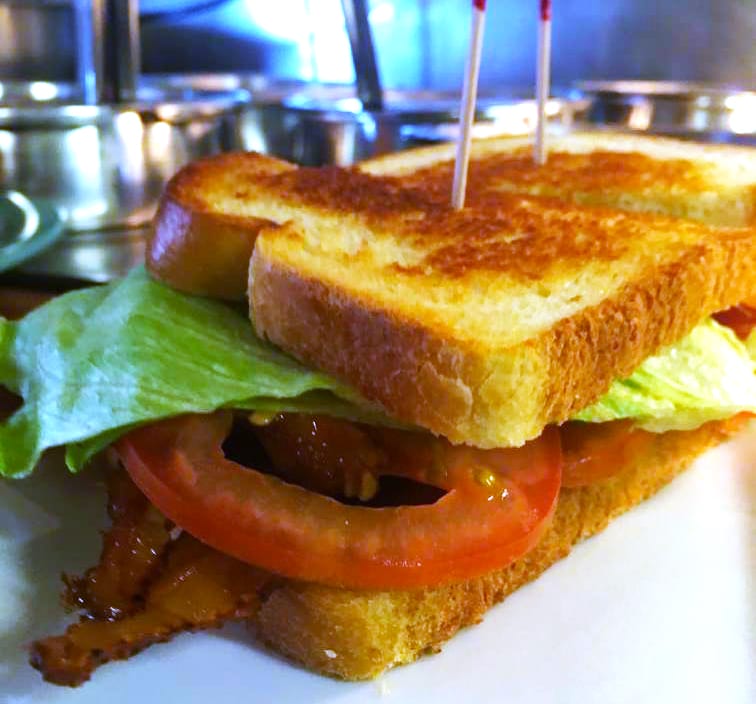Freshly cooked bacon lettuce and tomato sandwich