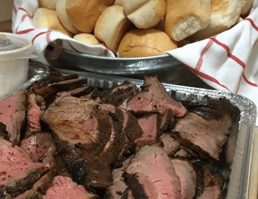 Succulent slices of barbecued meat with handmade freshly baked rolls